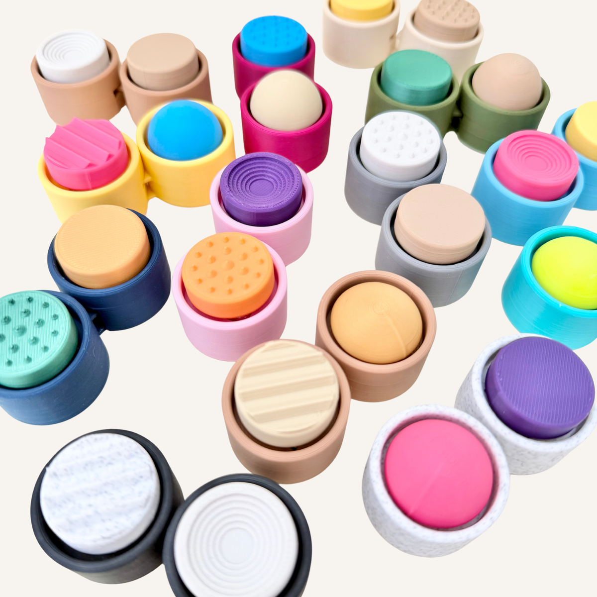 Double sensory clicker with an adjustable centre joint and two customisable tactile clicker caps.