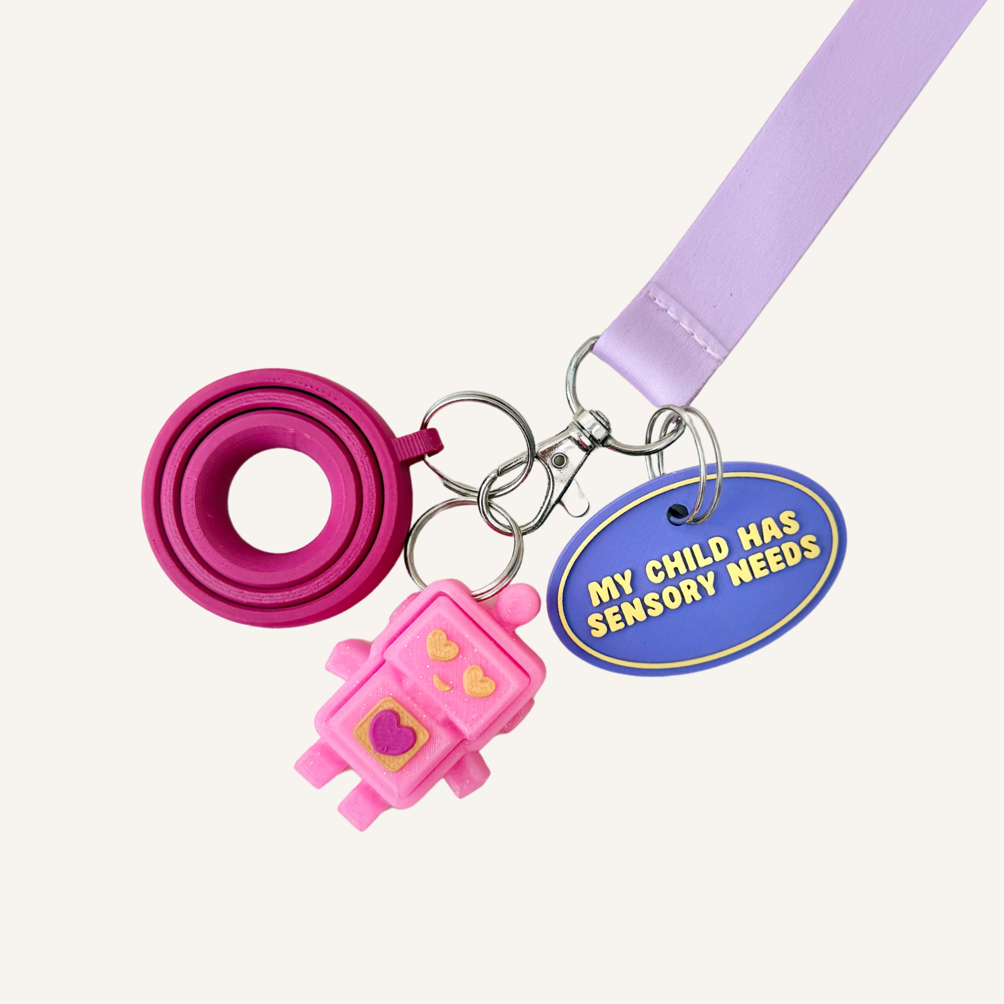 Portable message tag with silver loop fitting for lanyards, bags, keys and zipped pouches.