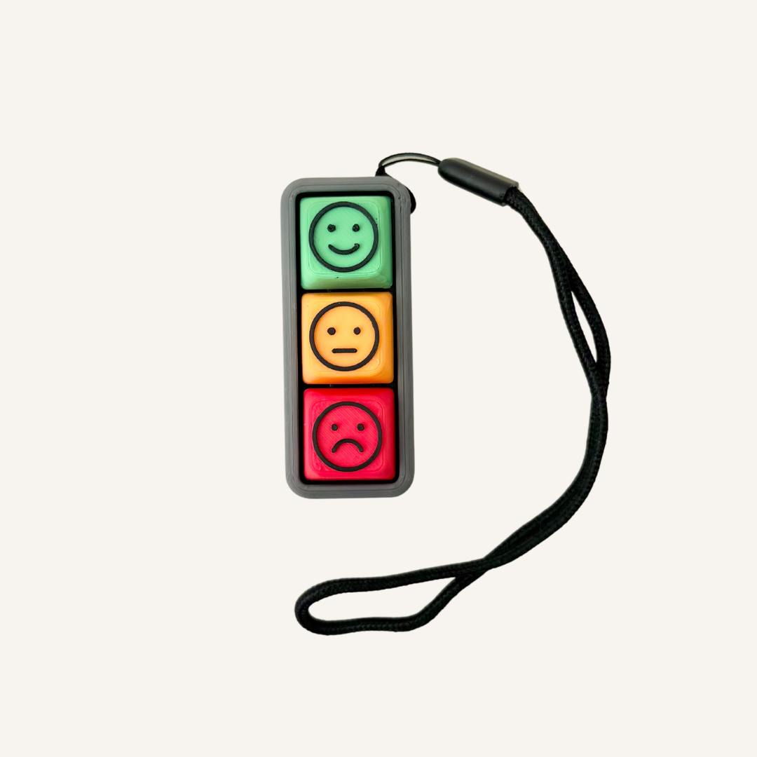 Three-button emotion clicker with happy, neutral and sad faces for sensory feedback and feelings support.