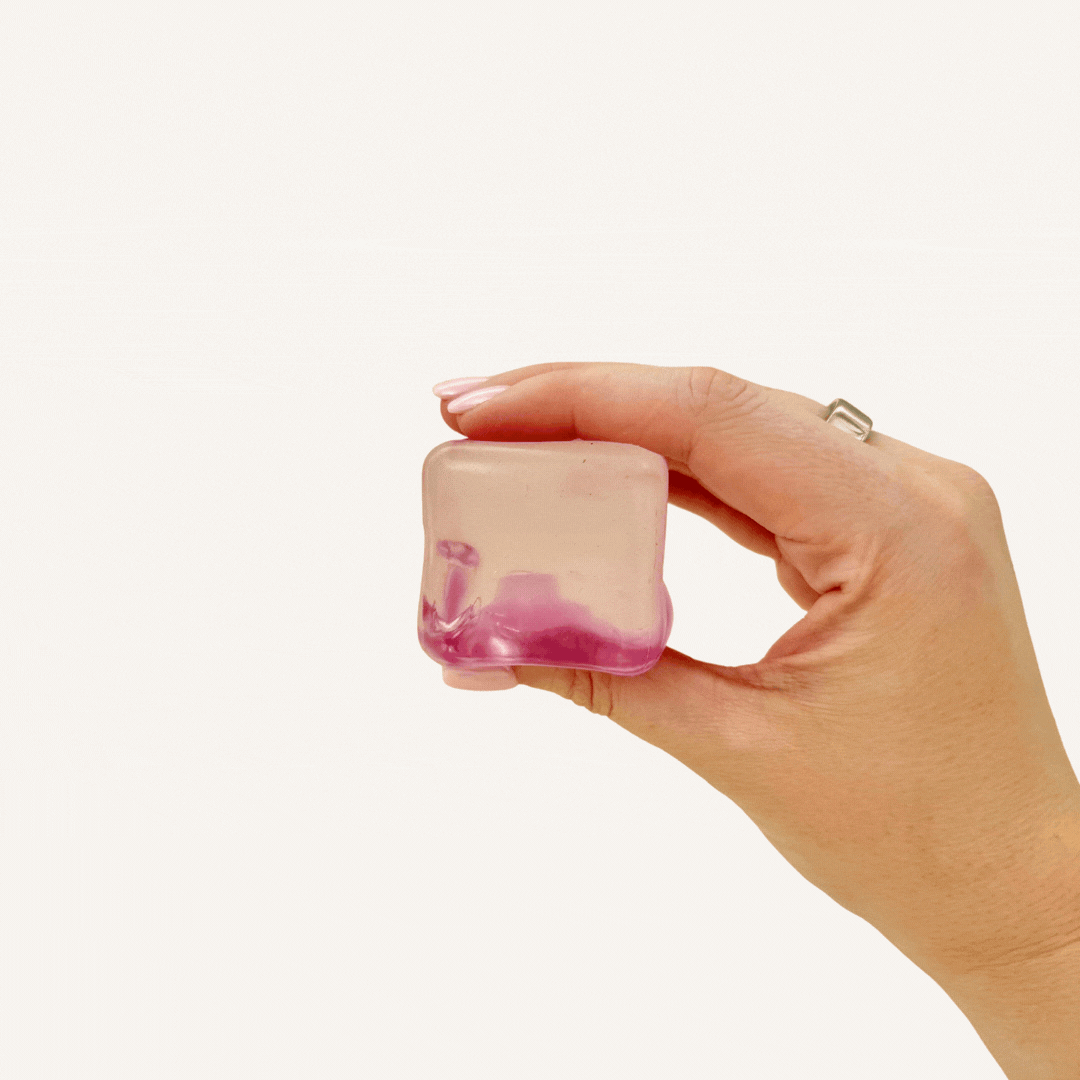 Compact smooth squishy fidget designed for two-hand squeezing and soothing sensory regulation during busy moments.