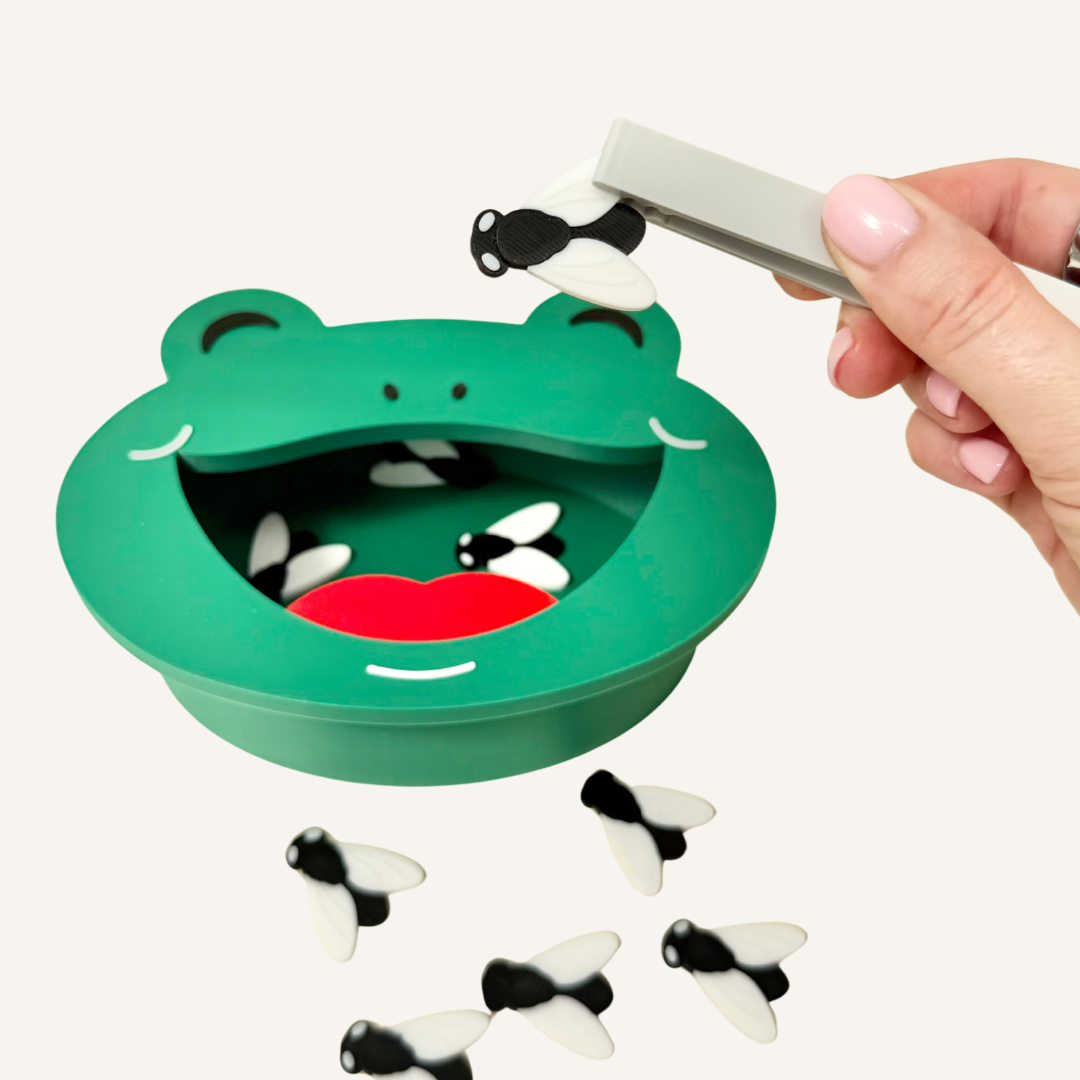 3D printed frog activity bin for tactile play, hand-eye coordination and low-prep sensory support.
