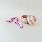 Fully articulated dragon in pastel tones with a matching rainbow egg decorated with embossed star details.