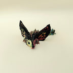 Highly textured sensory dragon toy with winged design and smooth movement