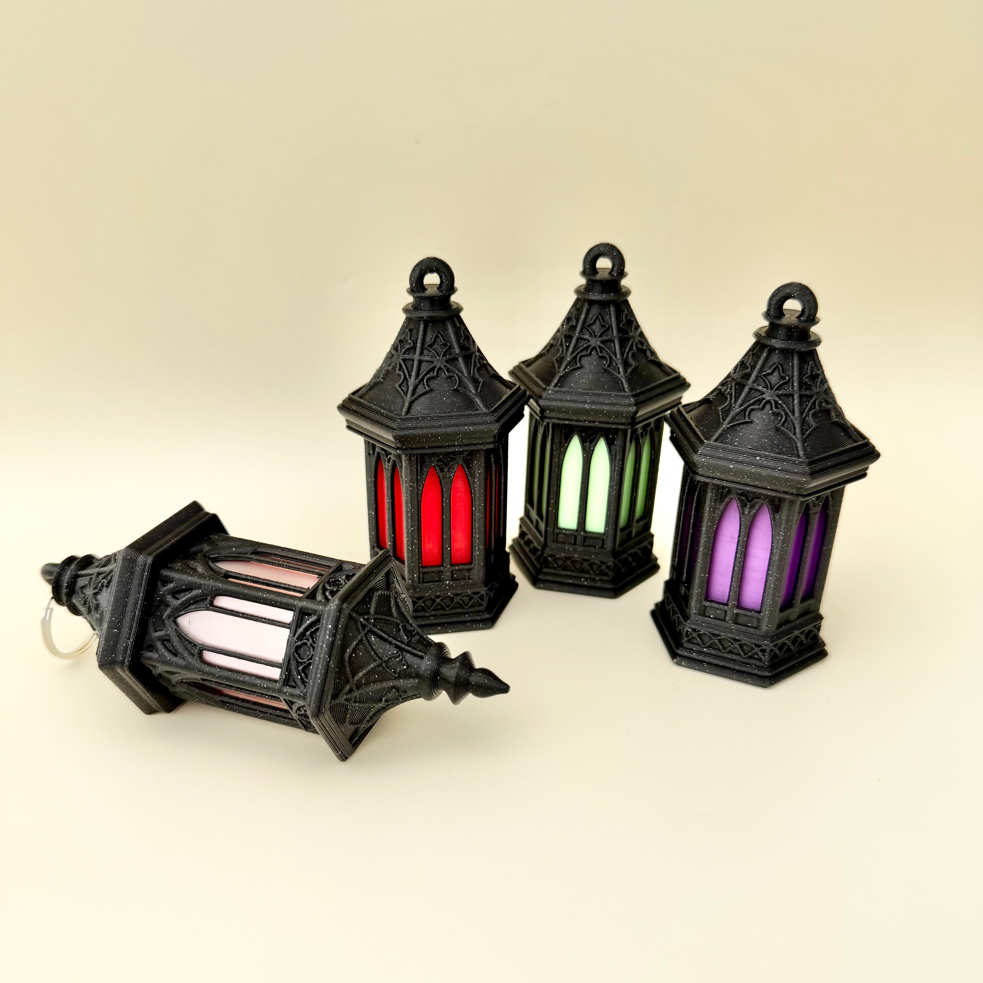 Compact gothic lantern charm with coloured insert and textured design for tracing and handling
