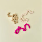 Lightweight flexible fidget with gentle movement for stimming, pacing, work and school use.