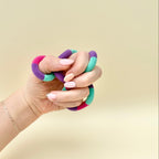 Textured twist-and-turn fidget with satisfying movement and a soft fuzzy feel for stressy moments and fidget breaks.
