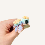 Tiny pastel turtle fidget designed for tactile input, collecting and playful spring-inspired sensory moments.
