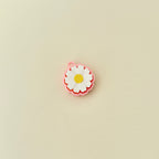 Lightweight clicker fidget toy shaped like a daisy for portable sensory play.