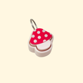 Small toadstool fidget keyring with smooth press top.
