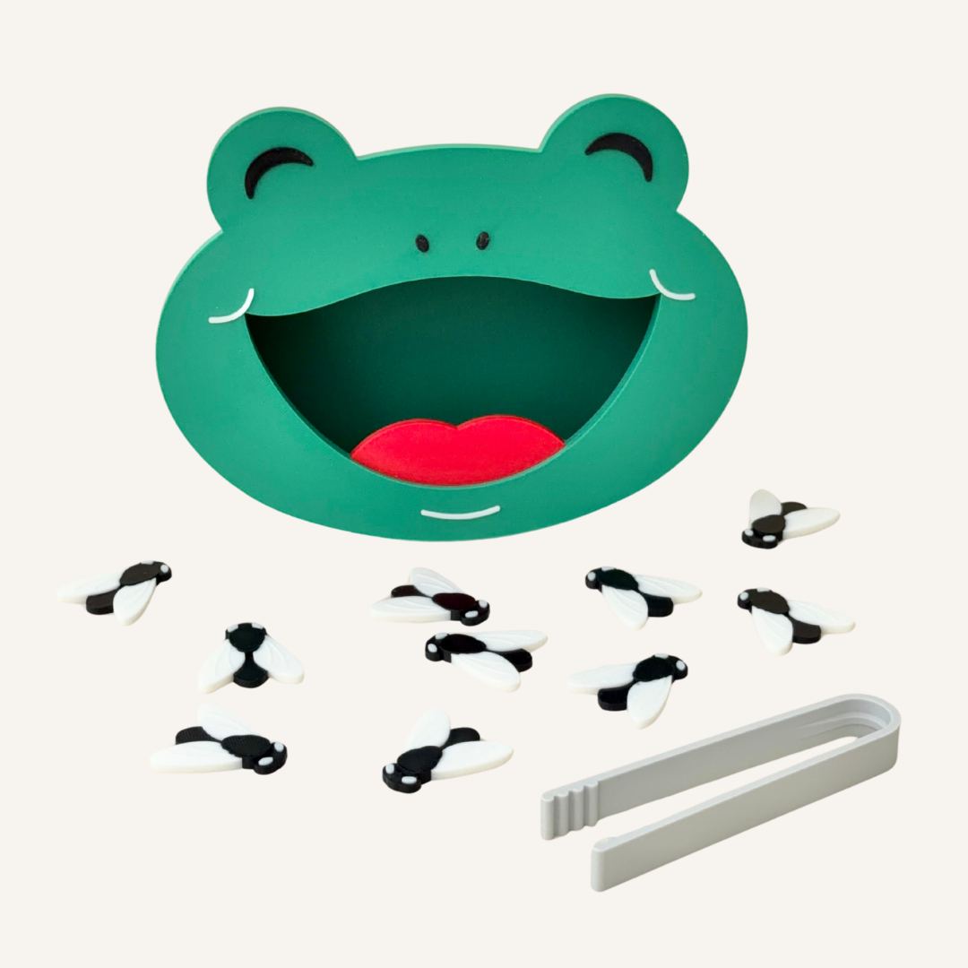 Reusable frog sensory play set with tweezers and flies for counting, sorting and fine motor practice.
