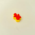 Compact sensory toy with a balloon animal design and pressable clicker centre.