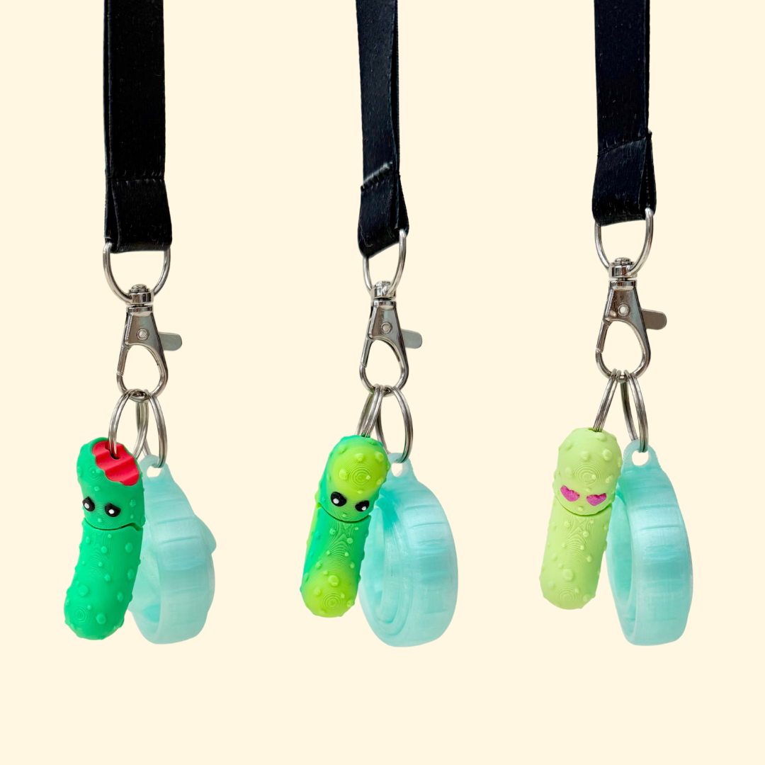 Compact pickle charm style stim tool for neurodivergent support, texture seeking and low movement fidgeting.
