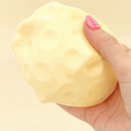 7cm cheese squish filled with gloopy gel for heavy, slow sensory squeezing.