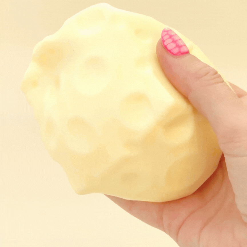 7cm cheese squish filled with gloopy gel for heavy, slow sensory squeezing.