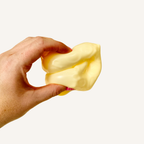Cheese-shaped gel squish with a smooth outer skin and satisfying heavy feel.