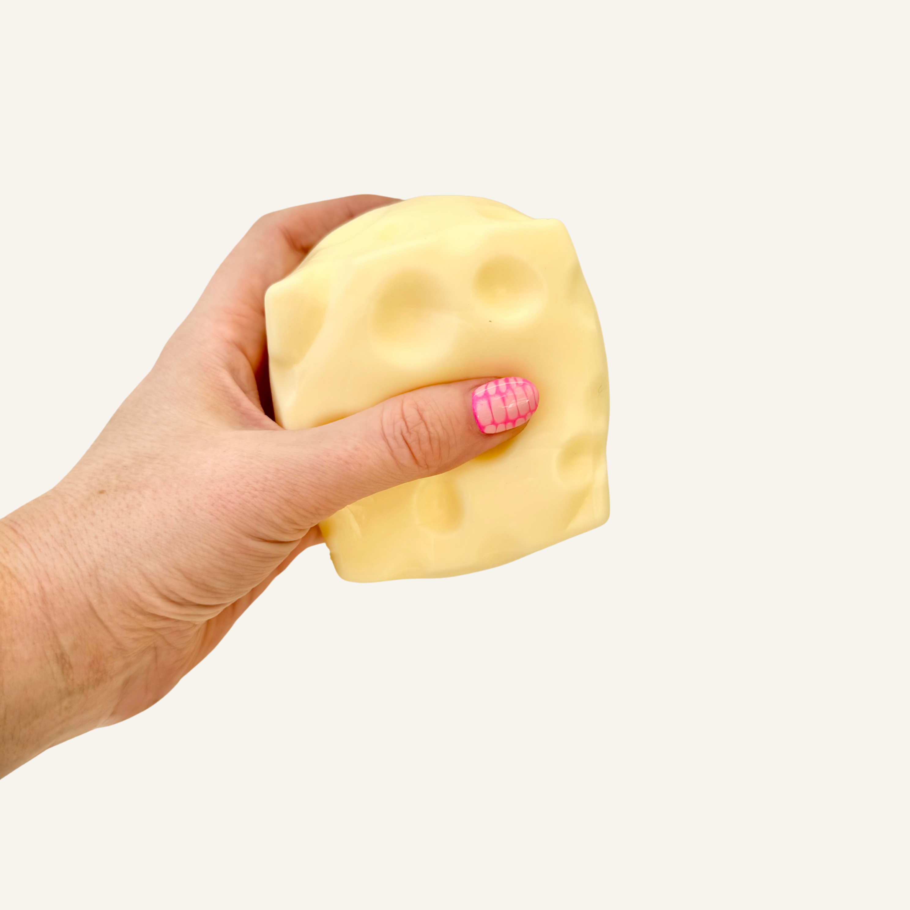 Gel-filled sensory cheese squish designed for bigger squeezes and stress relief.