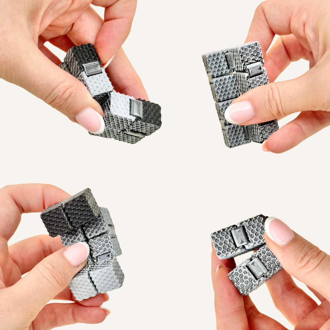 Textured mini FlexiCube in a black grey and white colour shift finish for tactile sensory fidgeting.