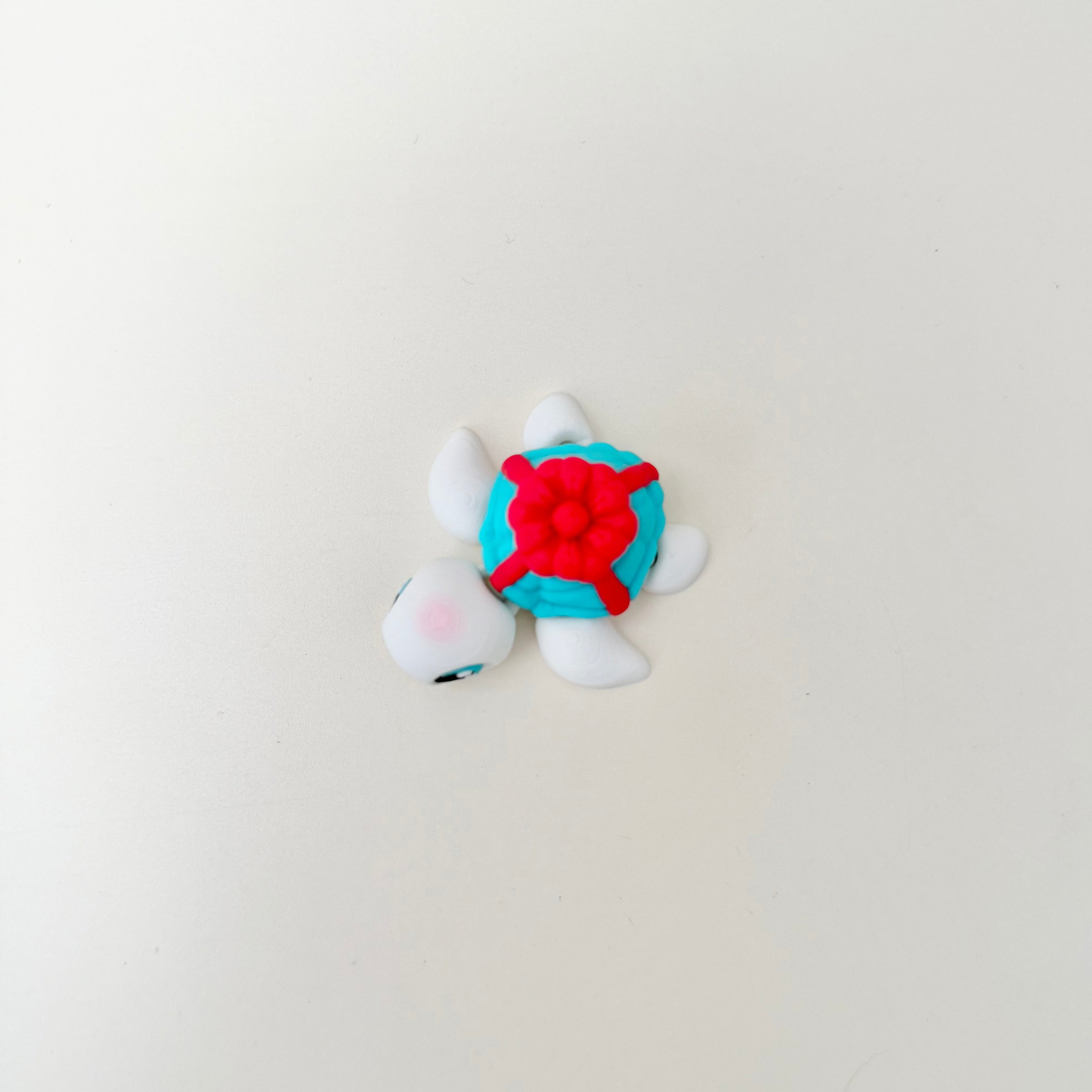 Small articulated turtle desk fidget with smooth movement, calming sensory input, and gift-friendly design
