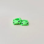 Frog fidget spinner with green body, small legs, and spinners in the middle, perfect for sensory play.