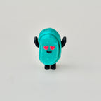 Mini sensory clicker fidget with a shimmery finish and textured feel, designed for portable calming input.
