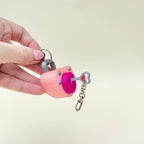 Press-to-click heart lock fidget keyring with movable key detail for portable sensory regulation.
