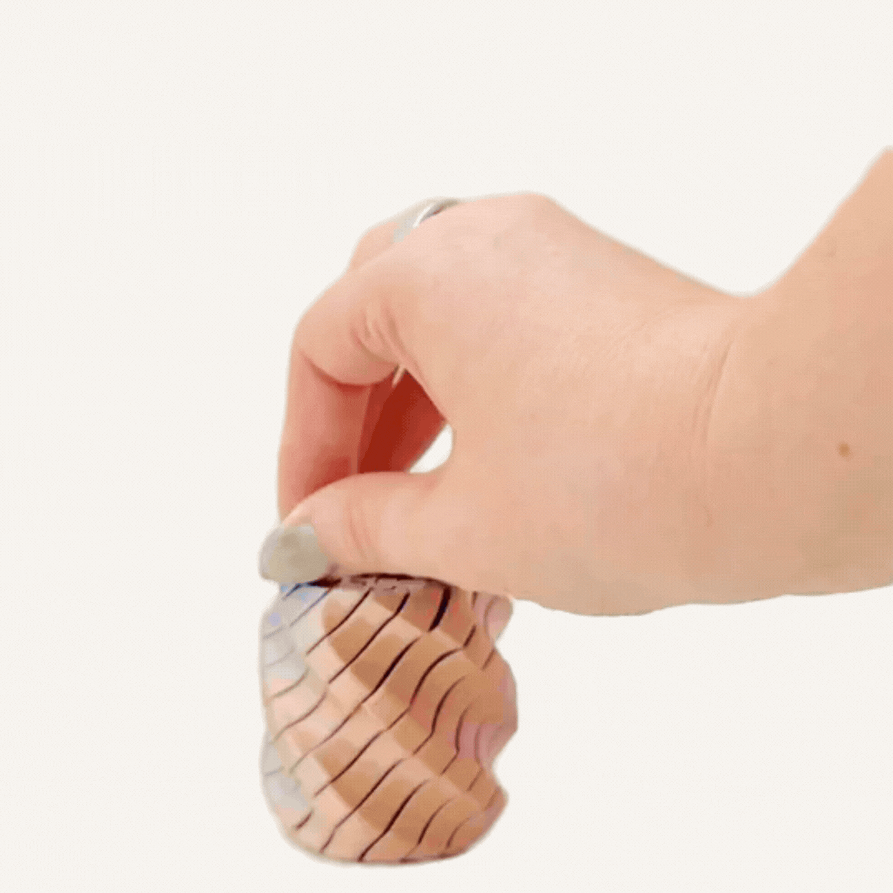 Modern spiral fidget with sculptural shape, textured movement and changing colours as it shifts.
