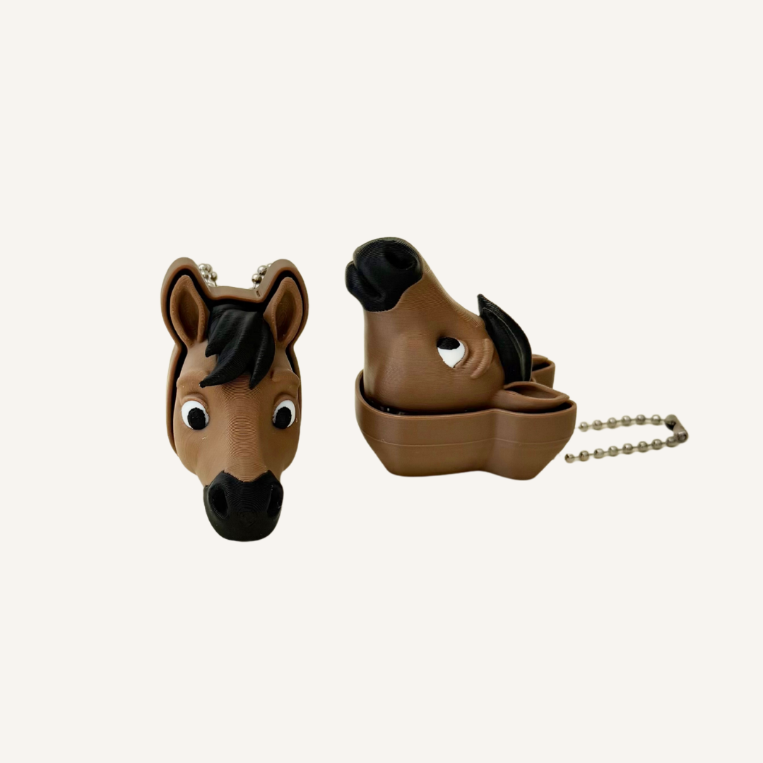 Small horse-themed keyring fidget with pressable click feedback for busy hands and focus support.