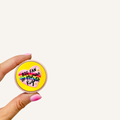 Round Big Fan of Human Rights sensory clicker with pressable feedback for busy hands and focus support.