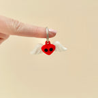 A small flying heart keyring that moves and shakes, perfect for fidgeting or gifting.