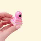 Portable clicker fidget with keyring hole for bags and lanyards, ideal for discreet stimming.
