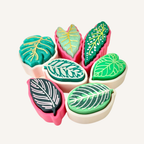 Tactile leaf shaped sensory fidget with raised texture, smooth base, click or quiet option, compact and handheld