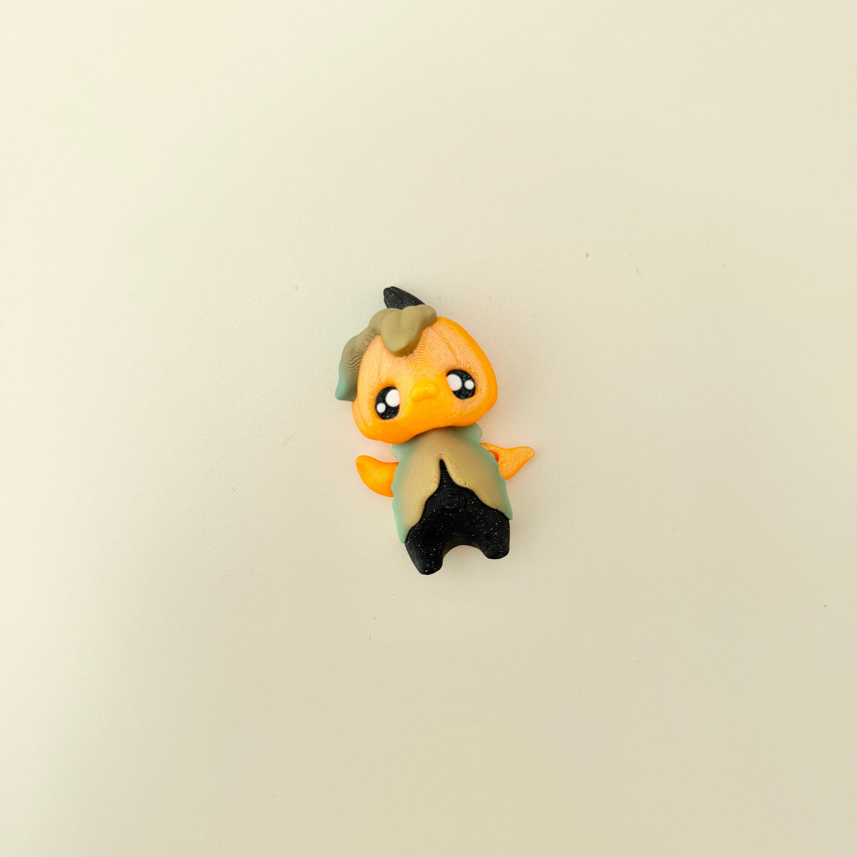 Compact pixie ornament with tactile surfaces suitable for grounding and focus.
