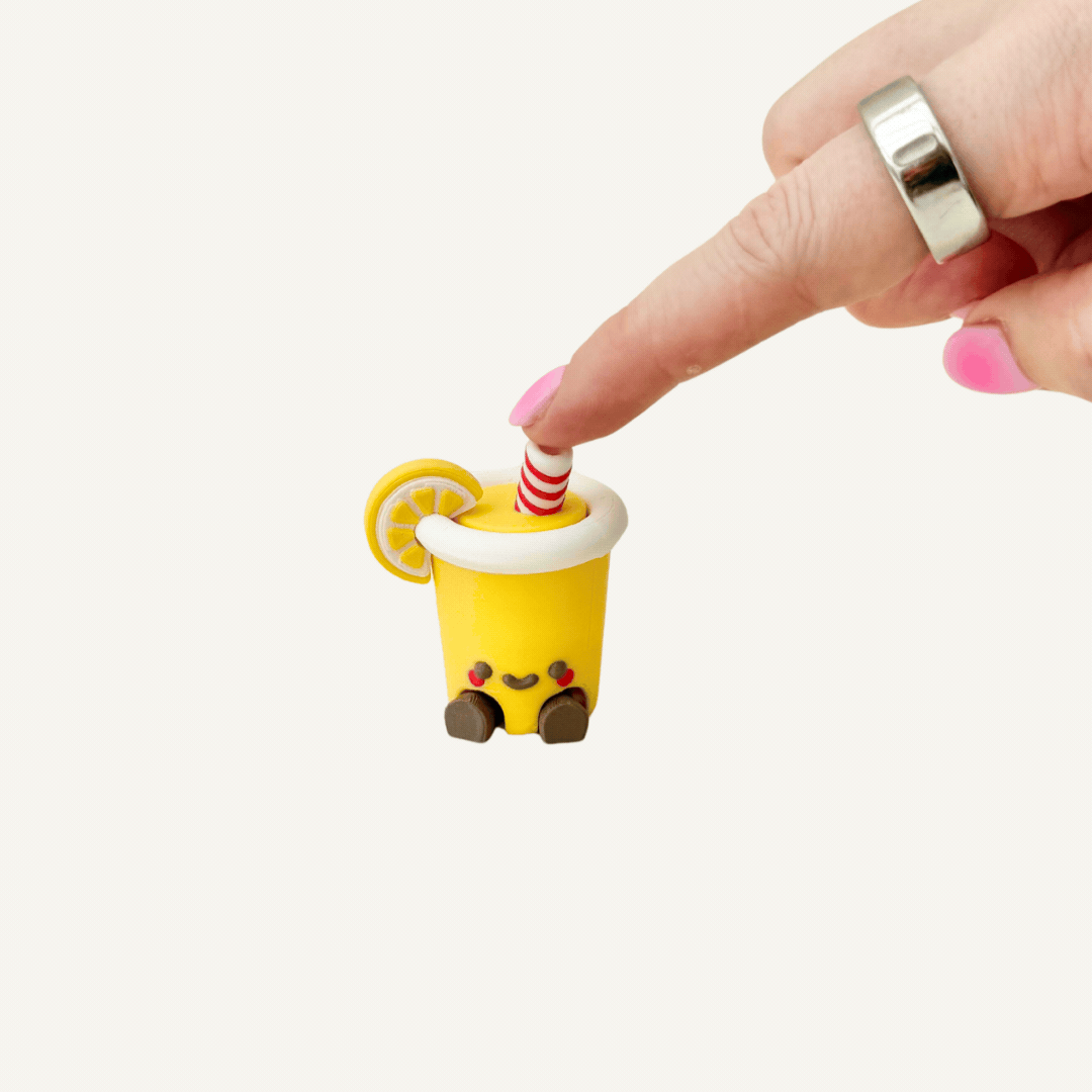 Cute lemonade drink clicker with straw detail for busy hands, stimming and focus support.