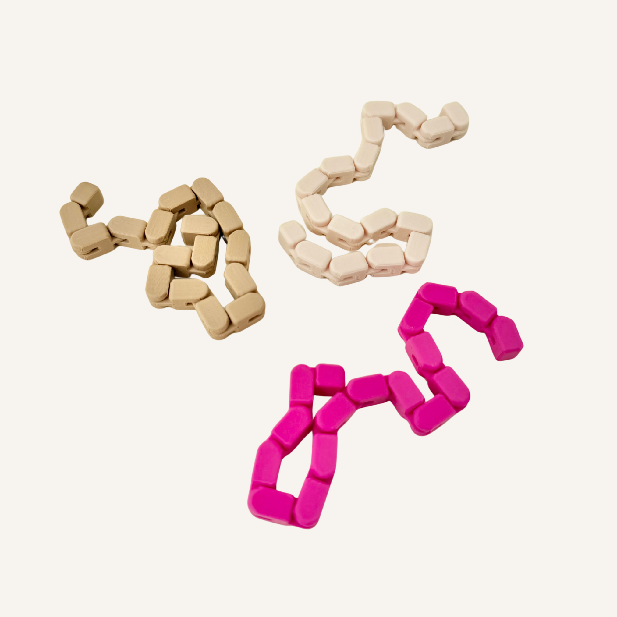 Quiet flexible finger loop fidget for rolling, weaving and repetitive sensory movement.