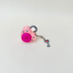 Handheld clicker fidget with key attachment and clip, designed for focus breaks and busy hands.
