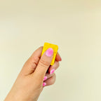 Small pair of cheese magnets for repetitive sliding, busy hands and low-effort fidgeting.