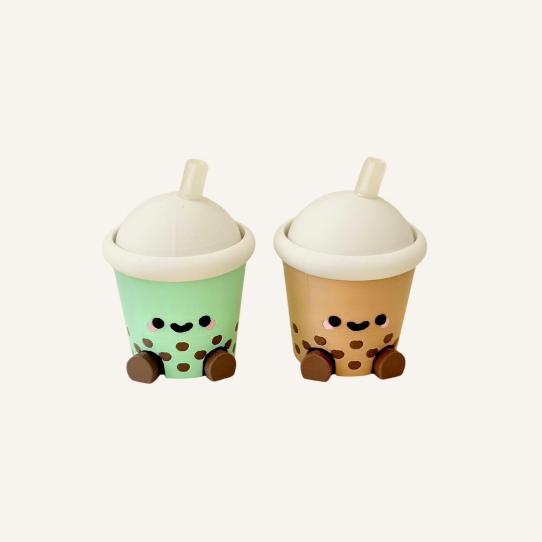 Kawaii bubble tea fidget clicker with tactile lid press and small desk-friendly size for stimming.
