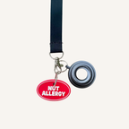 3D printed communication tag with raised text and silver loop for visible medical information.