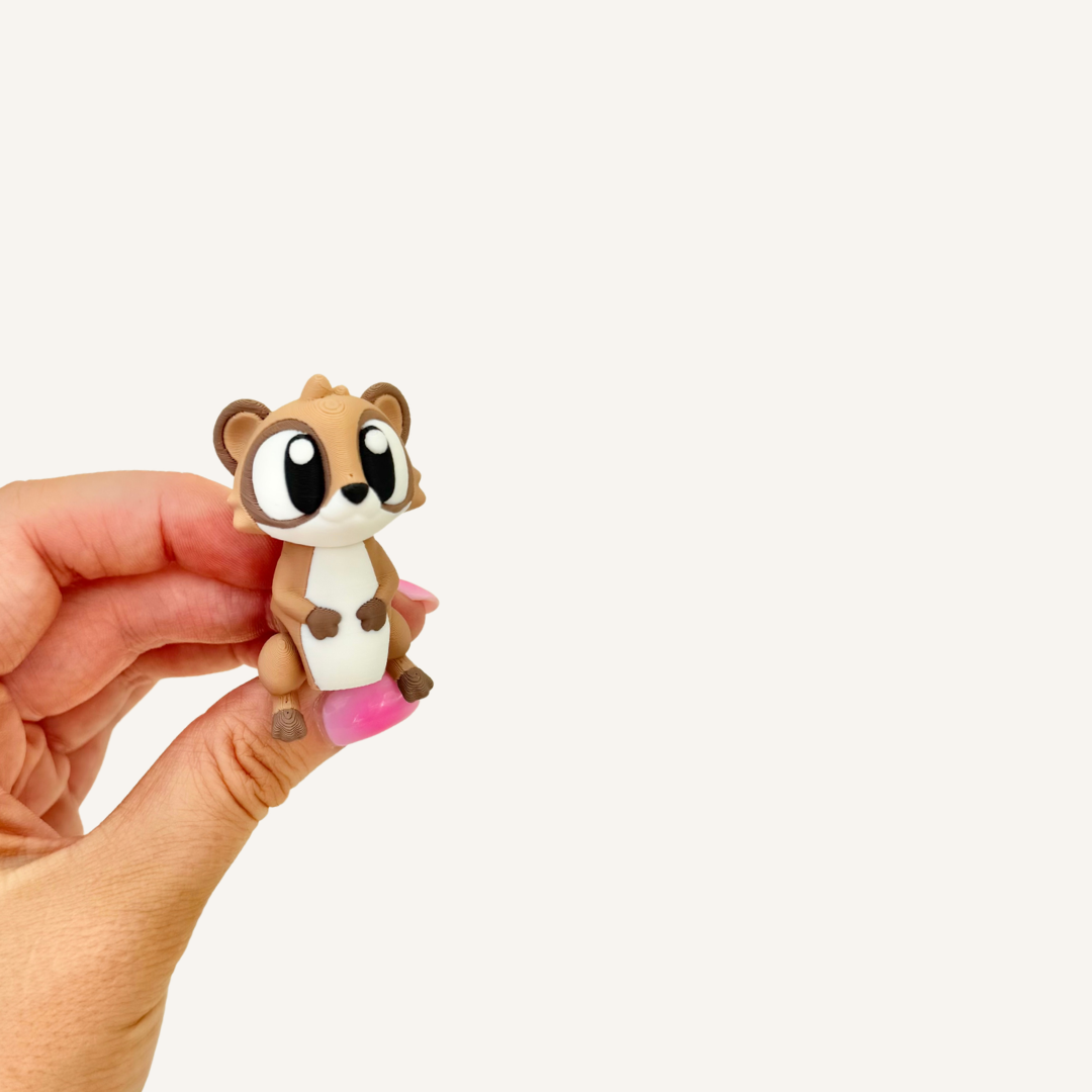 Small articulated meerkat fidget with smooth movement, ball-joint head and portable sensory use.