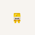 Cute mini milk carton character with dangling legs and straw detail designed for desks, shelves and calming decor spaces

