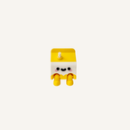 Cute mini milk carton character with dangling legs and straw detail designed for desks, shelves and calming decor spaces
