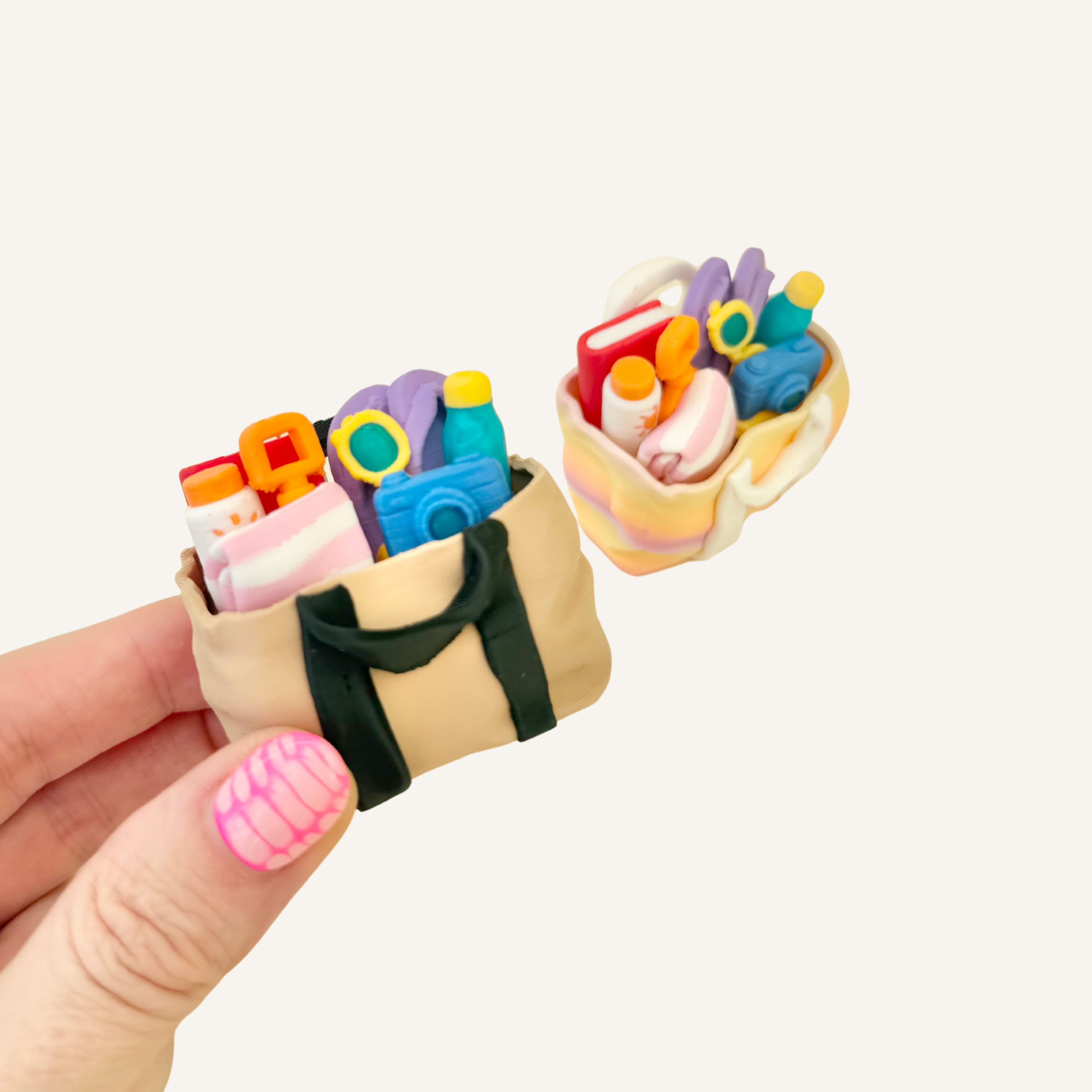 Pocket-sized beach bag clicker packed with tactile miniature holiday details.