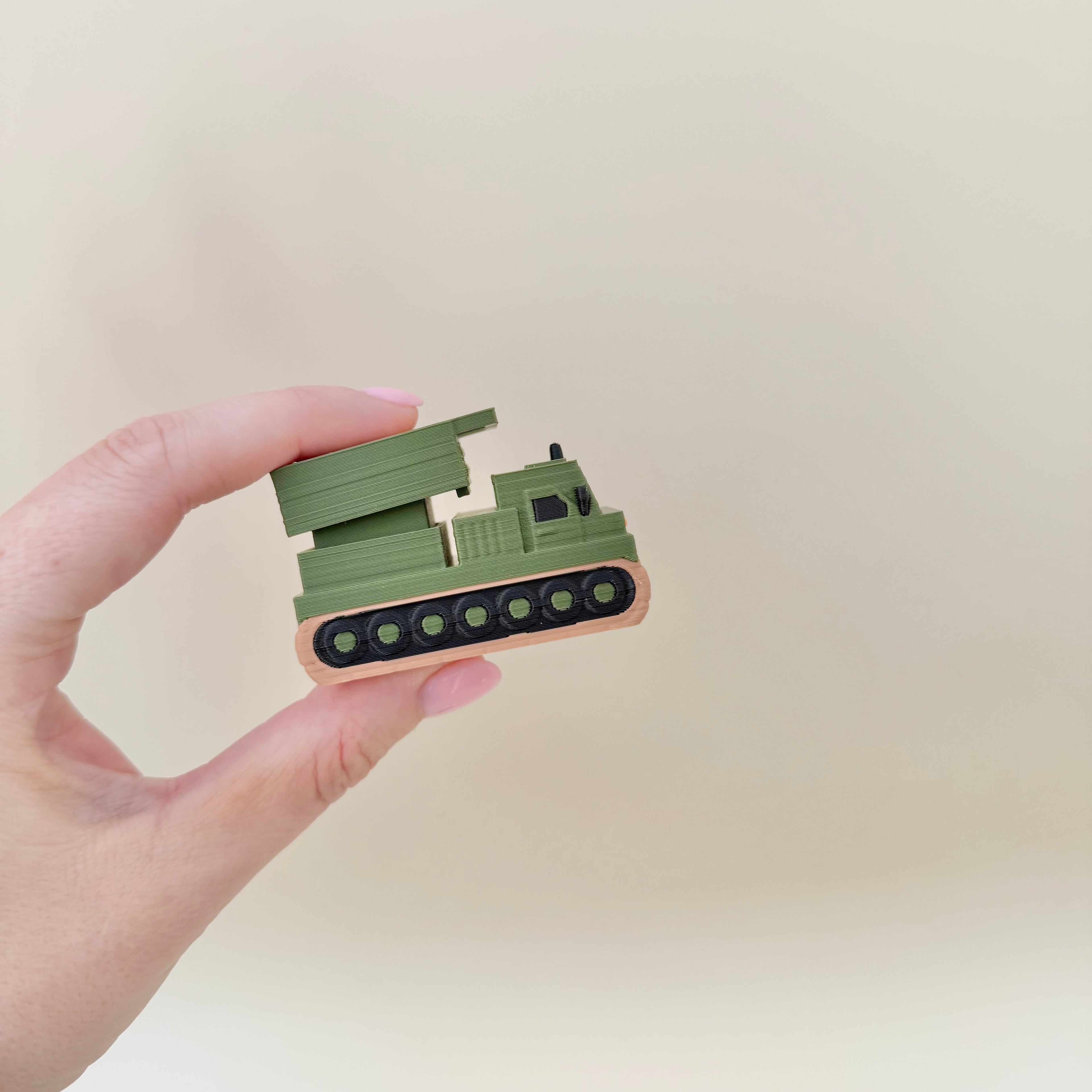 Handheld tracked clicker fidget with detailed design and optional quiet click upgrade for calmer use.
