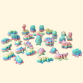 Small rainbow-coloured fidget toys with flexible, articulated bodies designed for sensory play.