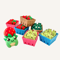Small sensory fidget toys featuring frogs and strawberries designed for tactile play and repetitive use