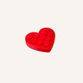 Compact heart shaped sensory fidget with press bubbles designed for repetitive motion and focus support.
