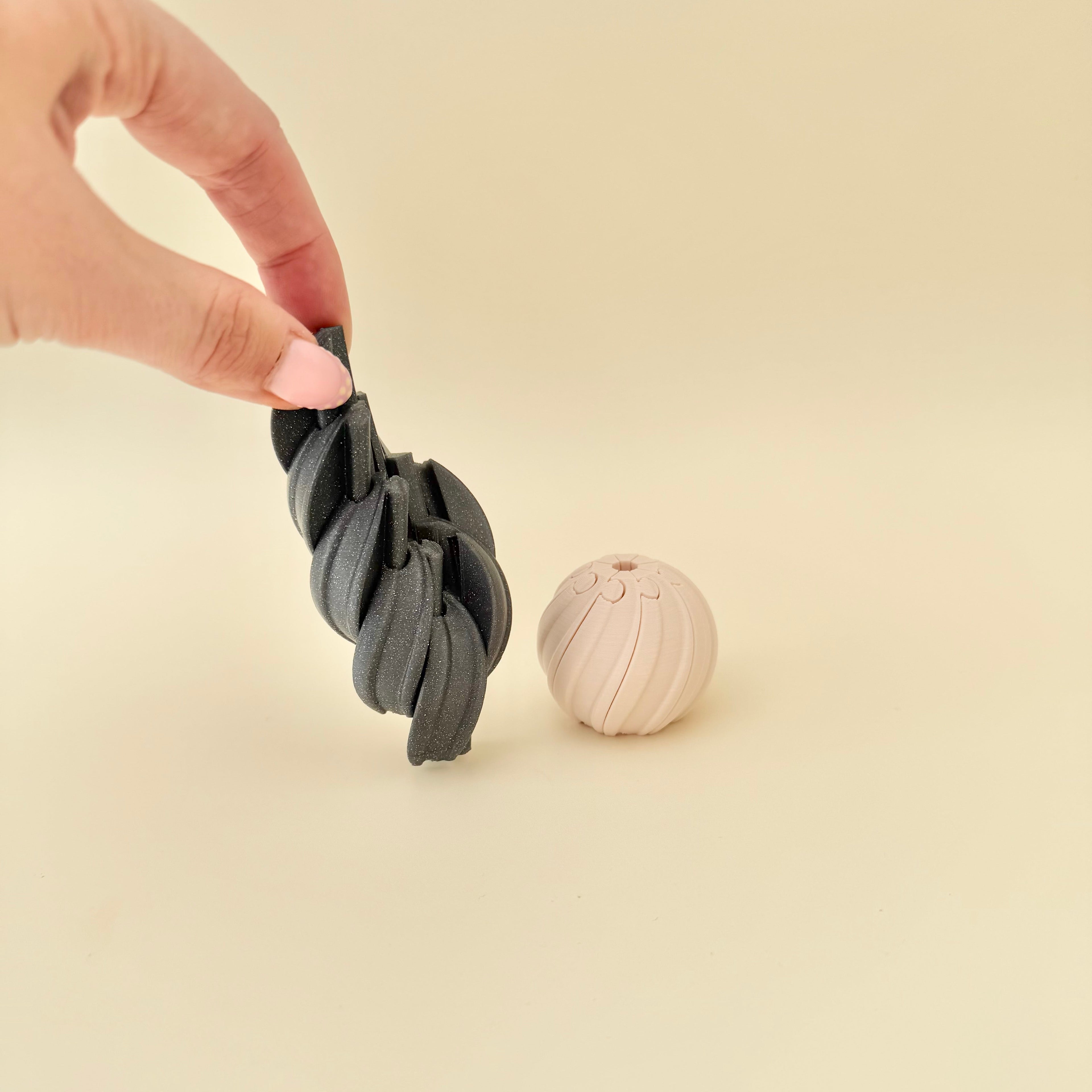 Compact rotating spiral fidget with tactile ridges for stimming, focus, and anxiety relief.

