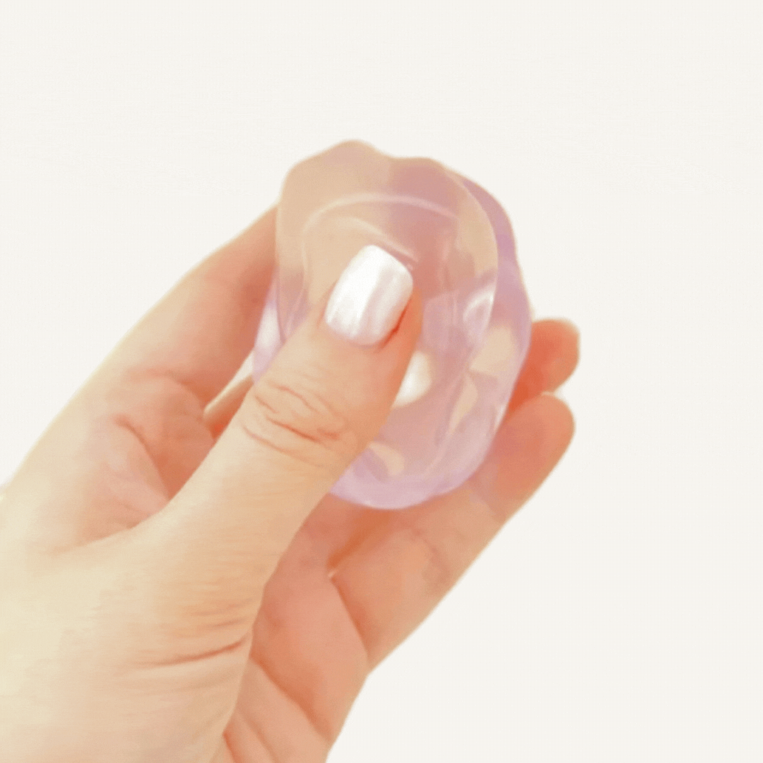 Smooth squishy fidget with minimal rebound for satisfying press-and-stay sensory input and grounding routines.