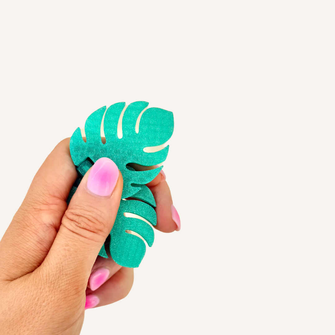 Leaf-shaped flip fidget with smooth movement for busy hands, focus support and sensory regulation.