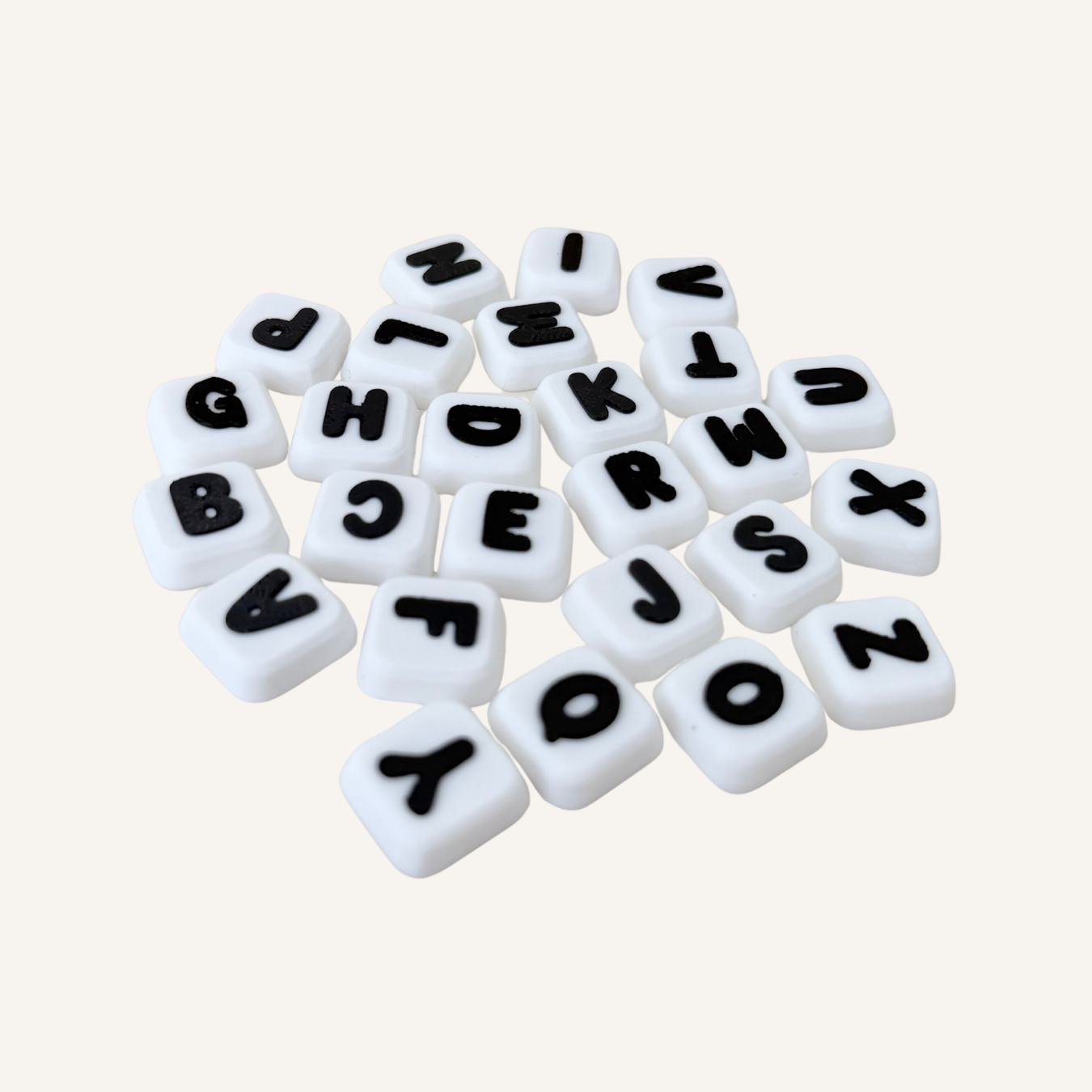Custom sensory clicker with multiple letter buttons for repetitive pressing, focus support and stimming.